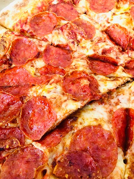 Pizza billede taget af Cristiano Pinto på Unsplash